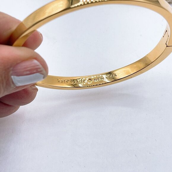 Kate Spade Gold Tone Bangle Bracelet Engraved Logo Clasp Closure - Picture 6 of 6